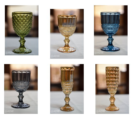 Platos de sitio de 33 y 35 cms en vidrio, cubiertos en dorado, copas de vino, espumante y vasos
